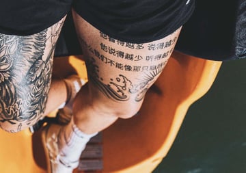 lettering tattoo with hieroglyphs